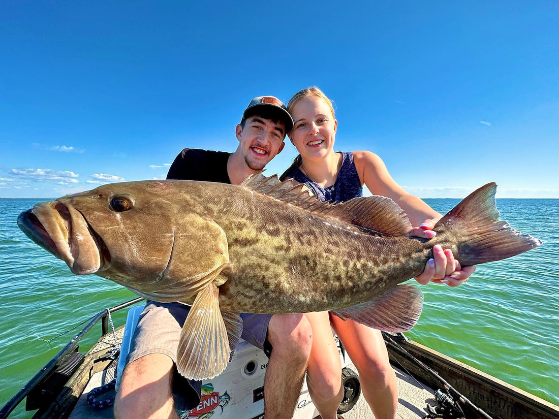 Couple Catch Large Grouper On Fishing Charter